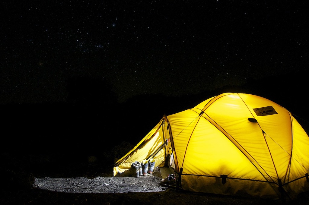 Lit up camping tent in the wild