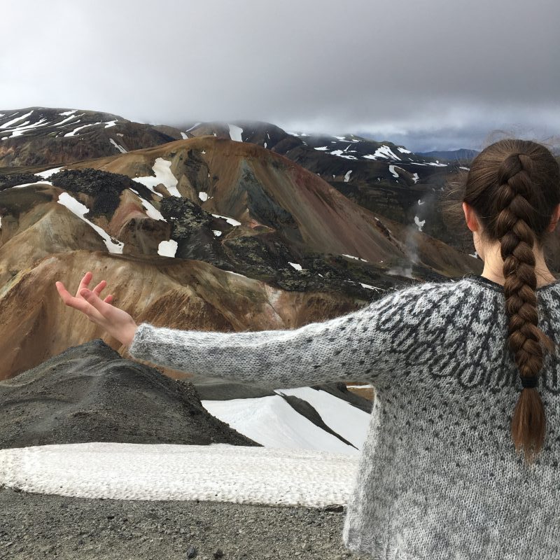 Woman in a Helene Magnússon lopapeysa sweater design in Landmannalaugur Iceland