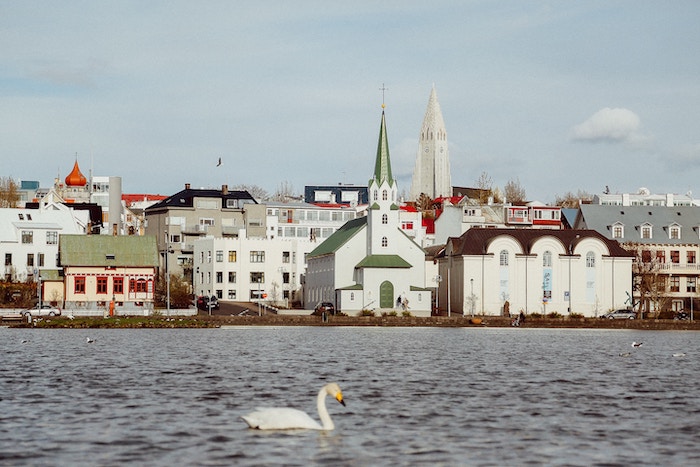 Skyline of Reykjavík, Iceland and Tjörnin lake in the downtown area.